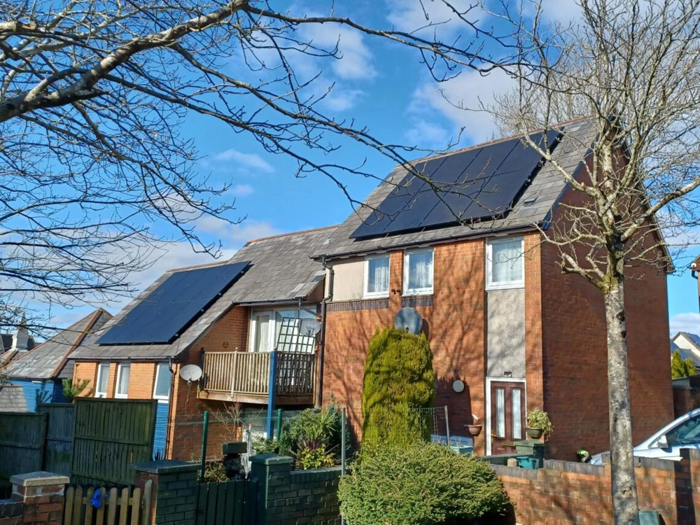 Solar panels installed on housing after retrofit works